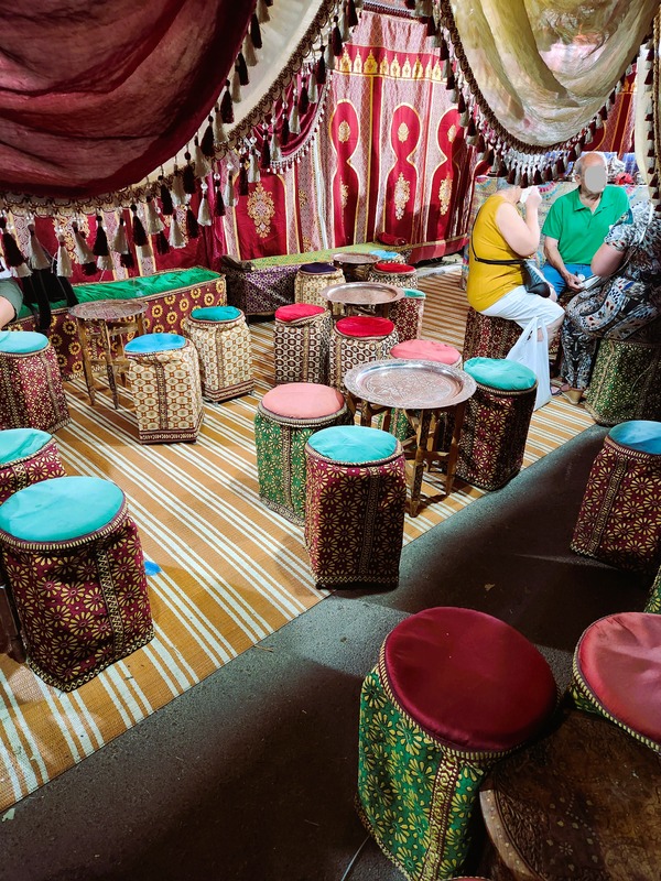 Arabic cafe with small tables and stools